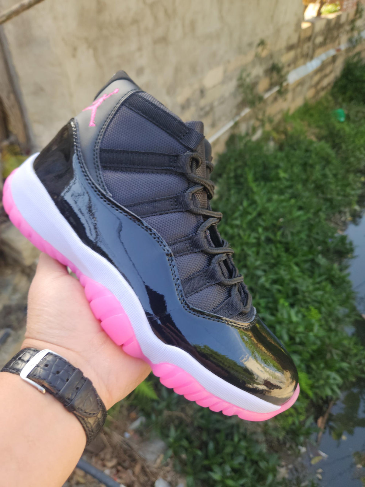 Air Jordan 11 Retro Black and Rose Red Sneakers
