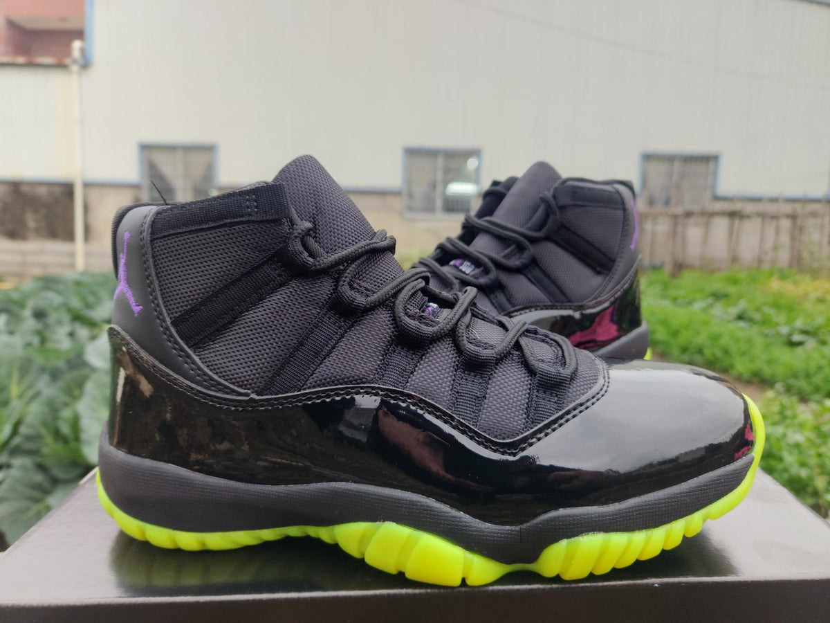 Air Jordan 11 Retro Black and Green Sneakers