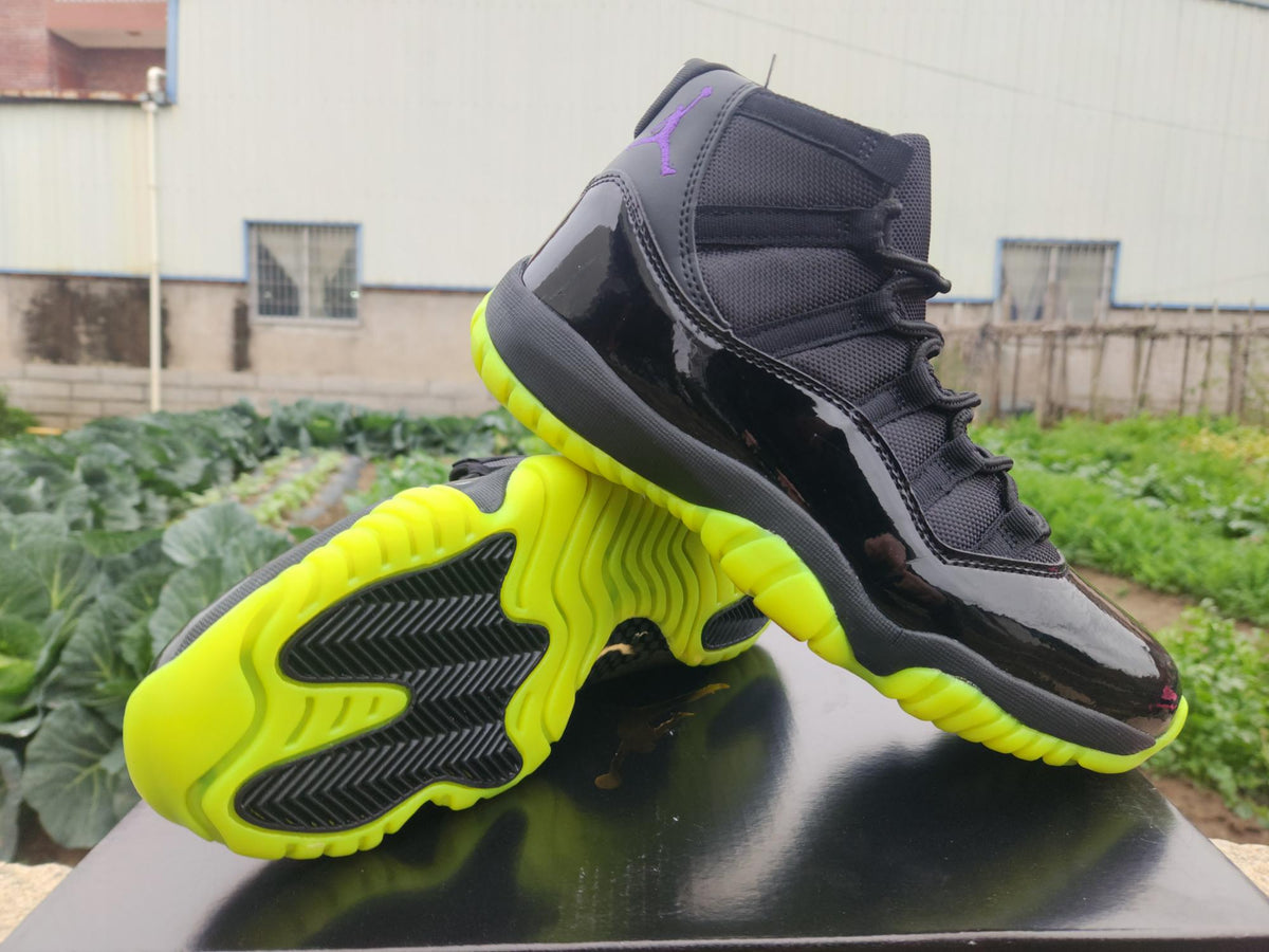 Air Jordan 11 Retro Black and Green Sneakers